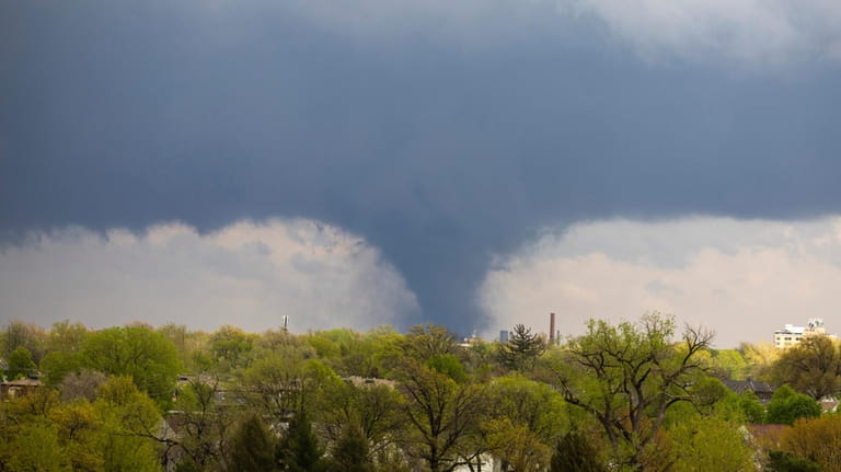 A tornado touches down on Friday, April 26, 2024, in...