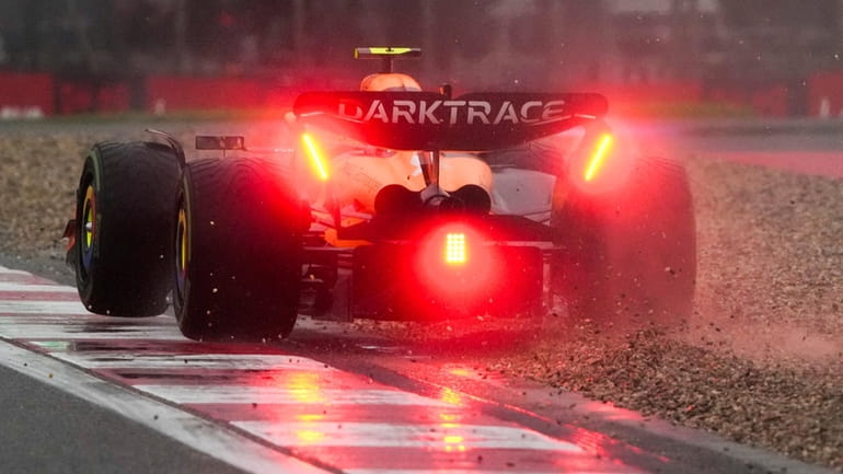 McLaren driver Lando Norris of Britain steers his car during...