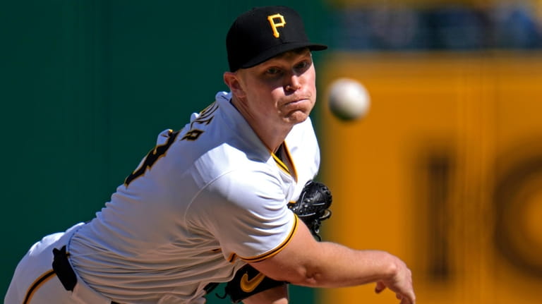 Pittsburgh Pirates starting pitcher Mitch Keller delivers during the first...