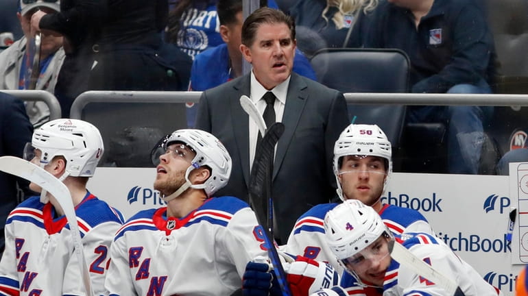 Rangers head coach Peter Laviolette looks on against the Islanders at...