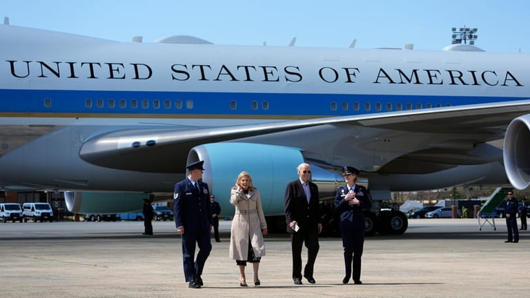 President Joe Biden, center right, and first lady Jill Biden,...