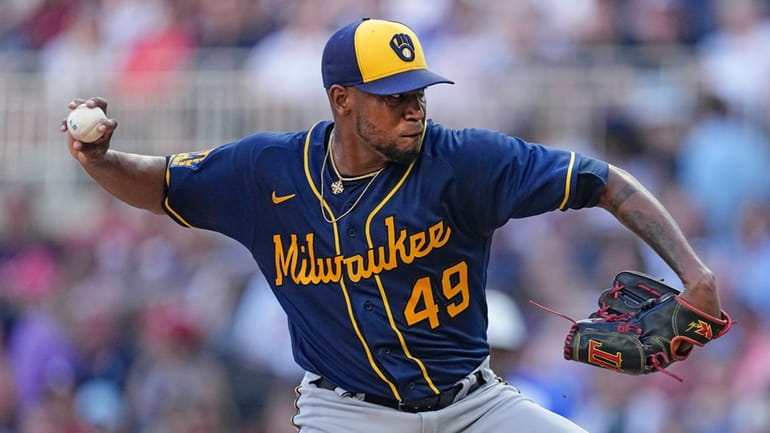 FILE -Milwaukee Brewers starting pitcher Julio Teheran delivers to an...