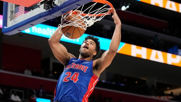 Detroit Pistons guard Quentin Grimes dunks during the first half...