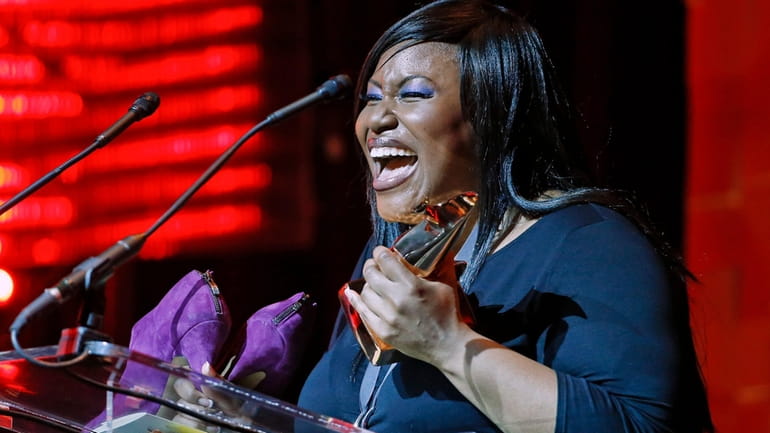 Mandisa accepts the award for pop/contemporary album of the year...