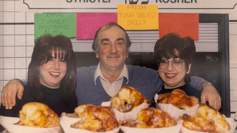 Emily Jacobson with her father and sister in Roslyn Kosher.
