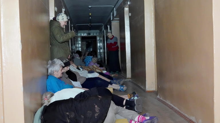 Patients take cover after a Russian attack on mental hospital...