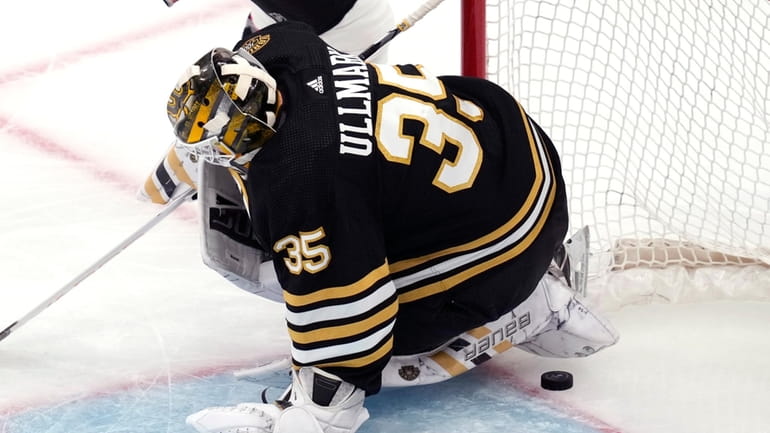 Boston Bruins goaltender Linus Ullmark drops to the ice, but...