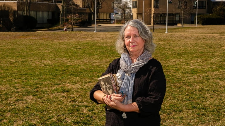 Carol Quirke, professor of American Studies, stands in the footprint...