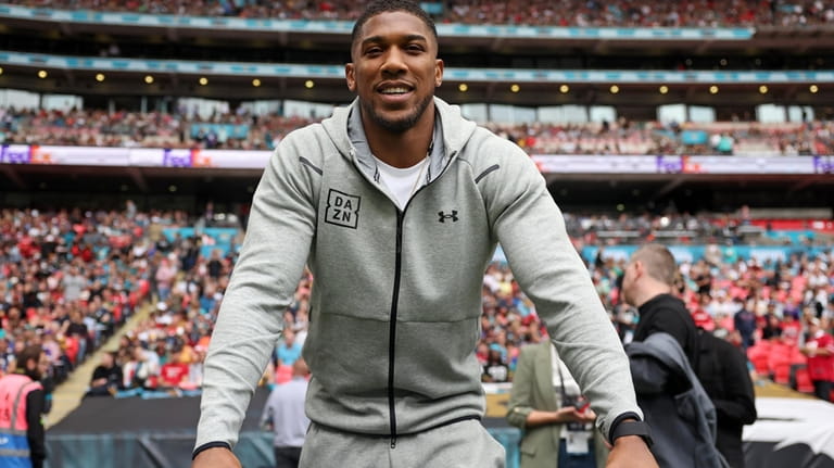 Heavyweight boxer, Britain's Anthony Joshua attends an NFL football game...