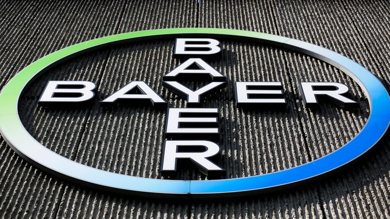 The Bayer AG corporate logo is displayed on a building...