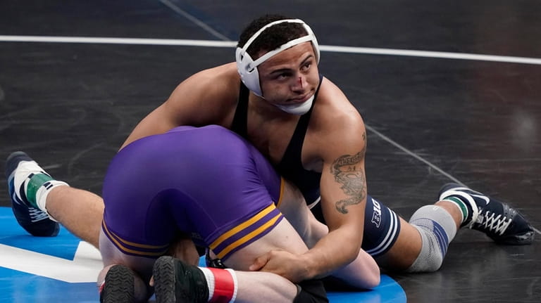 Penn State's Aaron Brooks, top, takes on Northern Iowa's Parker...
