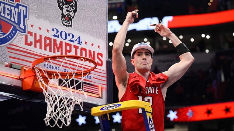 North Carolina State guard Michael O'Connell reacts as he cuts the net...