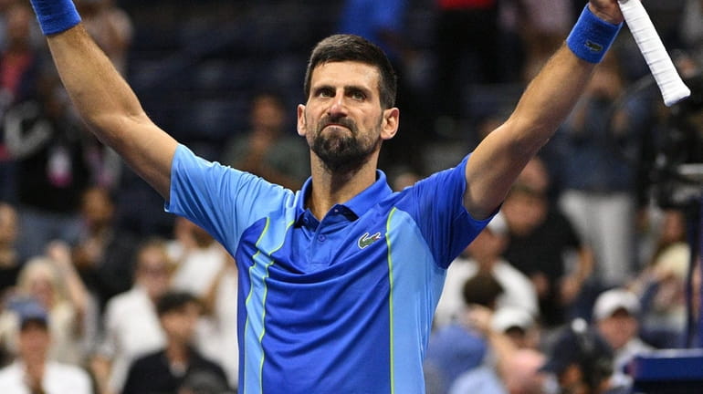 Novak Djokovic reacts after winning his match against Laslo Djere during...