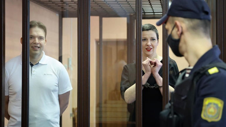 Belarus opposition activists Maria Kolesnikova, right, and Maxim Znak attend...