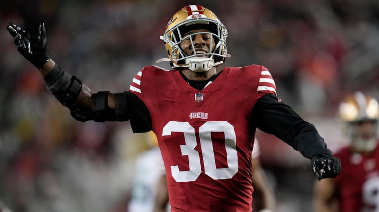 San Francisco 49ers safety George Odum (30) hypes up the...