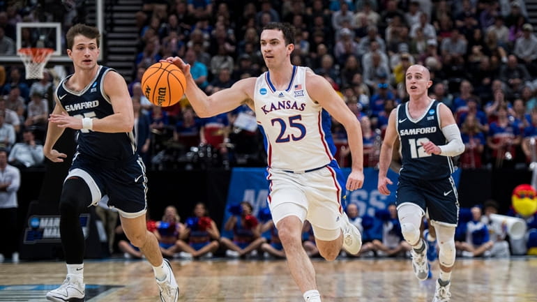 Kansas guard Nicolas Timberlake (25) brings the ball up-court between...