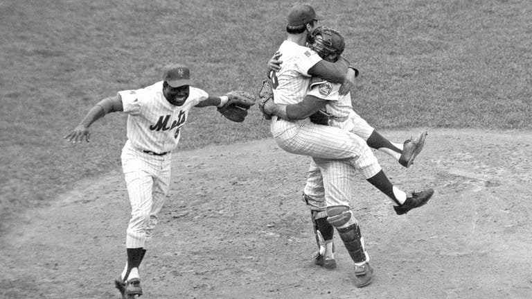 Mets catcher Jerry Grote, right, embraces pitcher Jerry Koosman as...