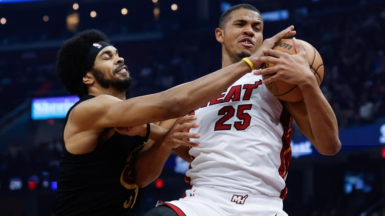 Miami Heat center Orlando Robinson (25) rebounds against Cleveland Cavaliers...