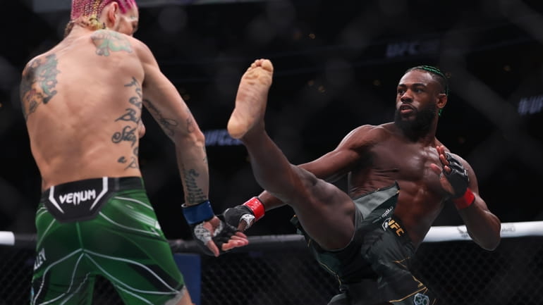 Aljamain Sterling, right. faces Sean O'Malley at UFC 292 in...
