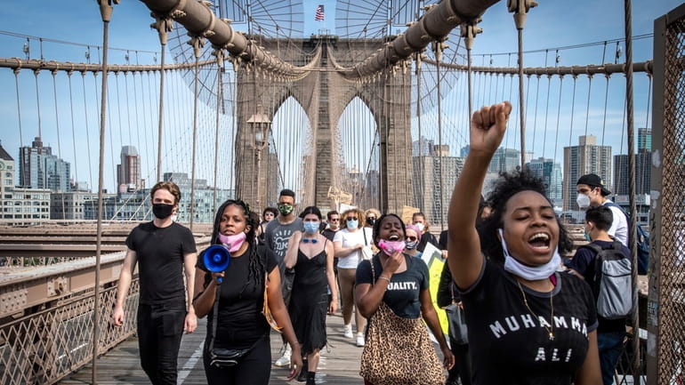 Demonstrators cross the Brooklyn Bridge on June 4, 2020.