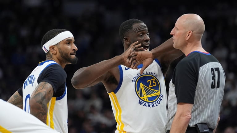 Golden State Warriors forward Draymond Green (23) talks with referee...