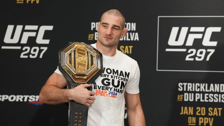 UFC middleweight champion Sean Strickland poses after speaking ahead of...