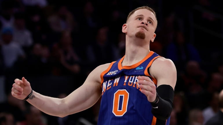 Donte DiVincenzo #0 of the New York Knicks reacts during...