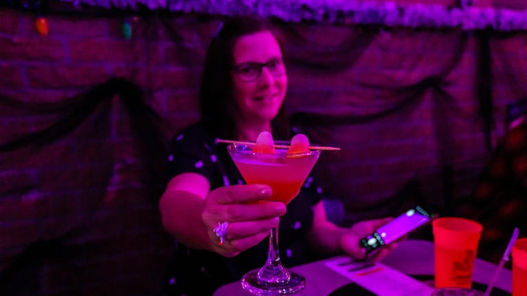Bonnie Riegler of Syosset drinks a Candy Corn Martini at...