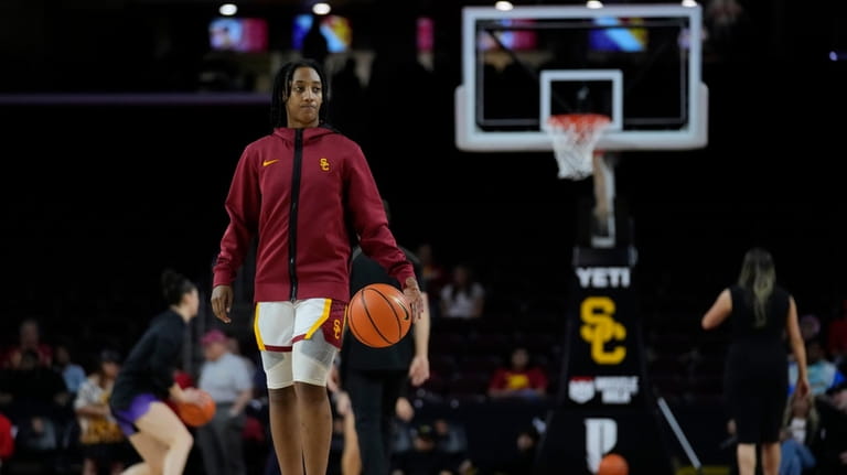 Southern California guard Aaliyah Gayles walks on the court before...