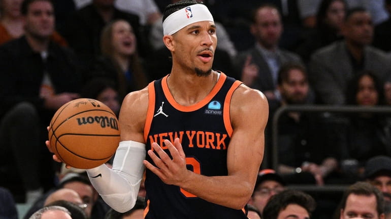 Knicks guard Josh Hart looks to inbound the ball against...