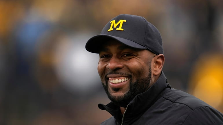 Michigan head coach Sherrone Moore watches during the NCAA college...