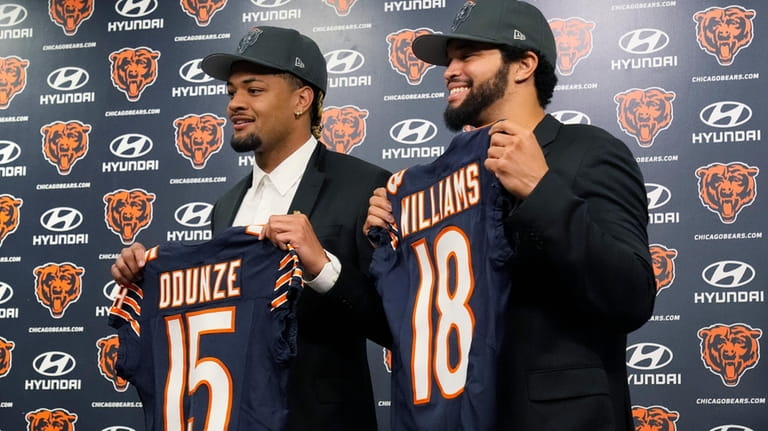 Chicago Bears draft picks wide receiver Rome Odunze, left, and...