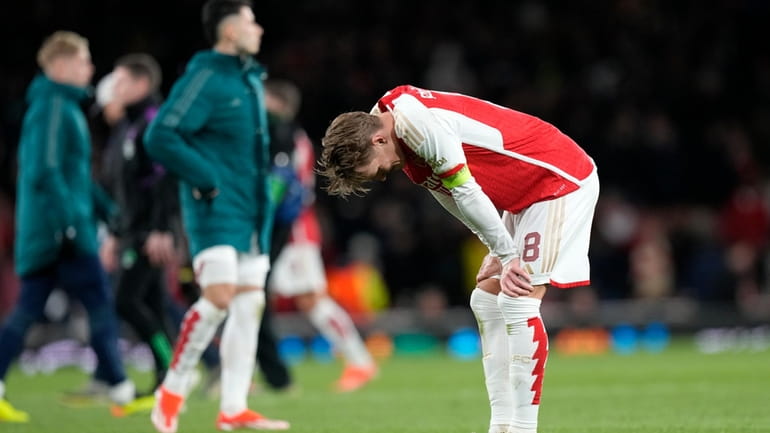 Arsenal's Martin Odegaard reacts disappointed after the Champions League quarter...