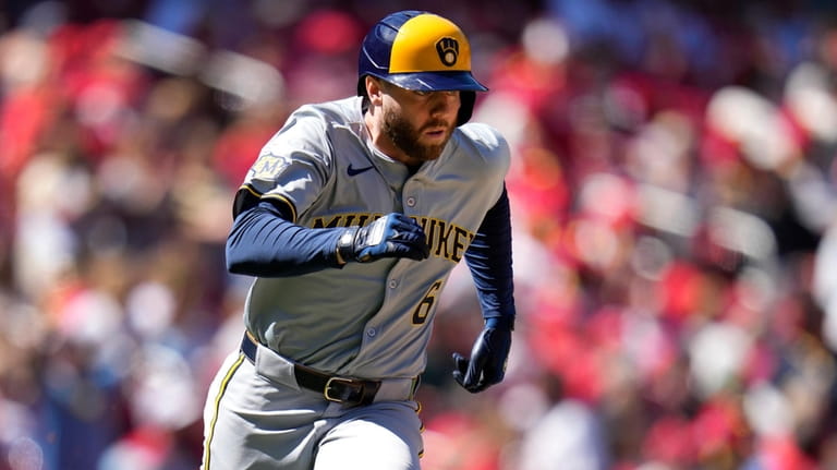 Milwaukee Brewers' Owen Miller heads to first on a two-run...