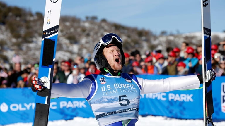 FILE -Michael Glasder (5) celebrates after winning the men's ski...