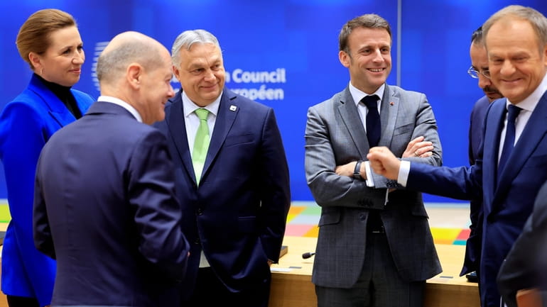 From left, Denmark's Prime Minister Mette Frederiksen, Germany's Chancellor Olaf...