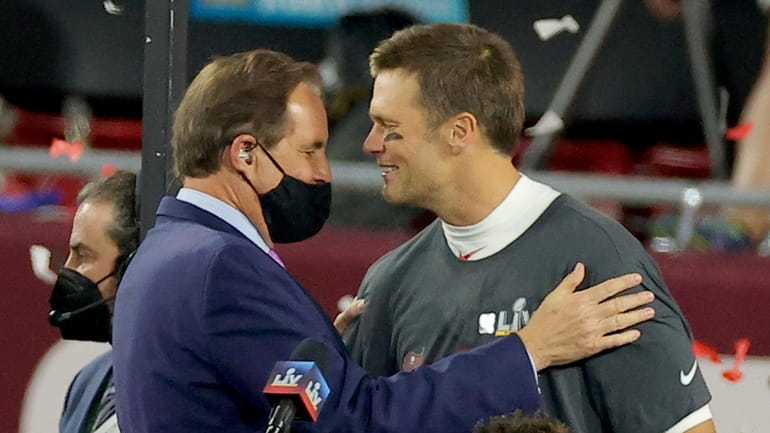 Tom Brady of the Tampa Bay Buccaneers speaks with Jim...