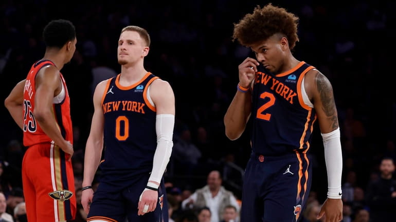 Miles McBride and Donte DiVincenzo of the Knicks look on during the fourth...