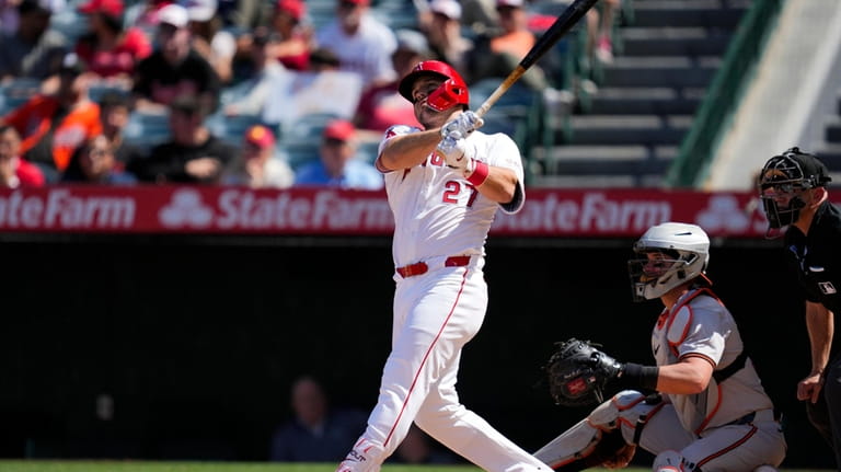 Los Angeles Angels designated hitter Mike Trout hits a home...
