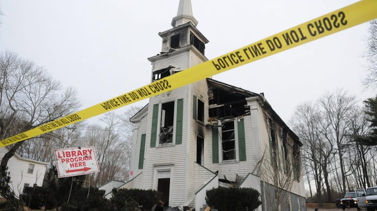 The historic Yaphank Presbyterian Church was heavily damaged in a...