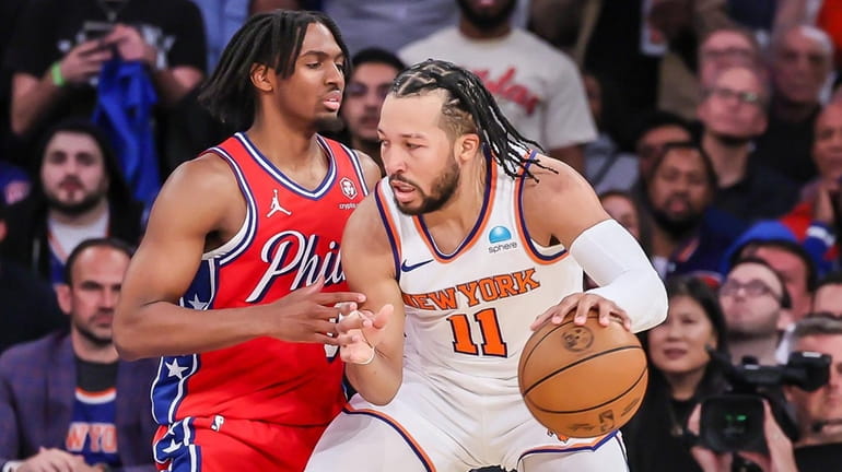 The Knicks’ Jalen Brunson drives against the 76ers’ Tyrese Maxey...