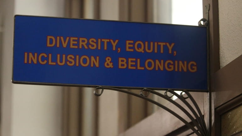 The sign above the door to the Office of Diversity,...
