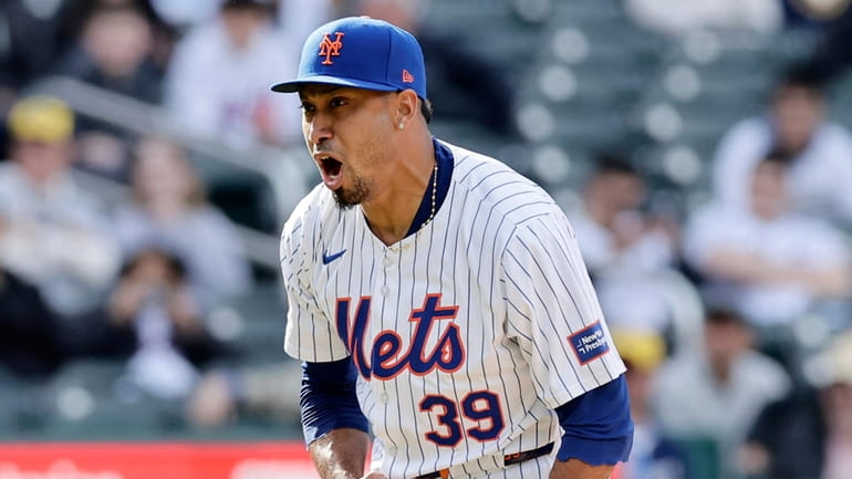 Edwin Diaz of the Mets reacts after the final out of the...