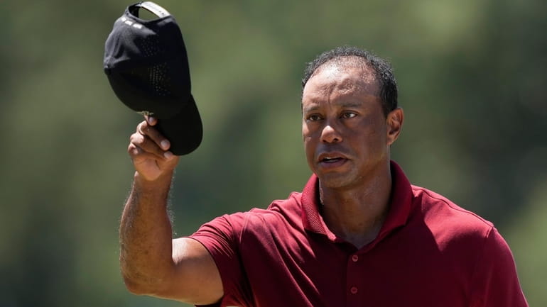 Tiger Woods waves after his final round at the Masters...
