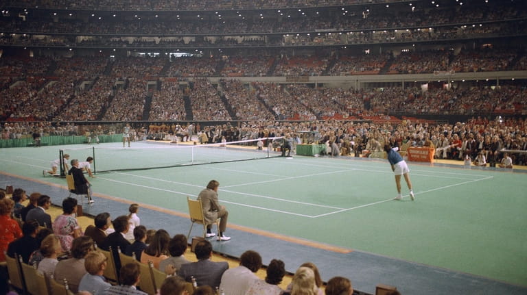 Billie Jean King and Bobby Riggs compete in the “Battle of...