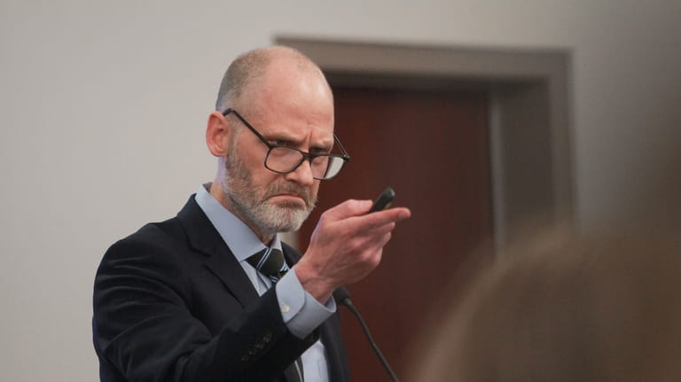 County Attorney Michael Jette addresses jurors during closing arguments in...