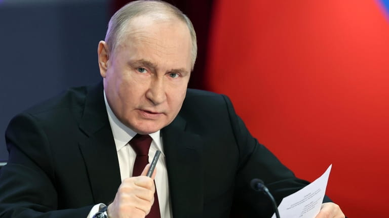 Russian President Vladimir Putin speaks at the annual meeting of...