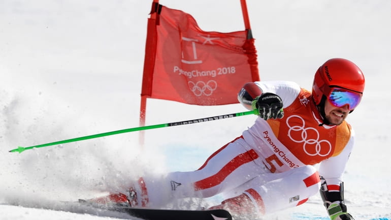 Austria's Marcel Hirscher skis to the gold medal in the...