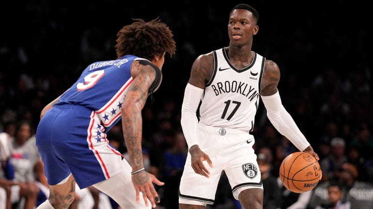 Dennis Schroder of the Nets dribbles the ball during a game...