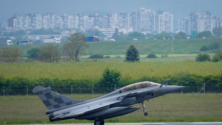 A French made Rafale fighter jet lands at the international...